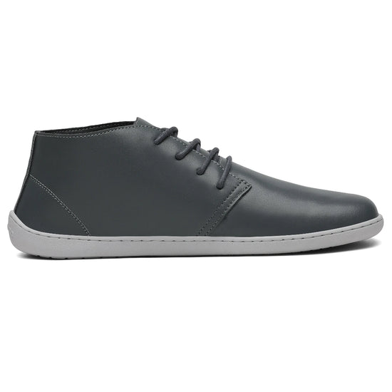 Calzado barefoot formal con suela plana zero drop y diseño ergonómico minimalista.