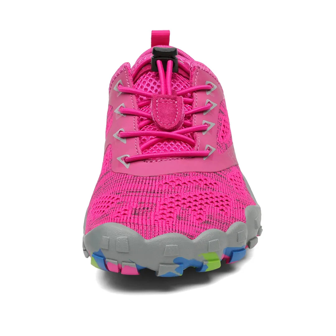 Zapatillas rosas vista frontal con puntera ancha ergonómica barefoot.