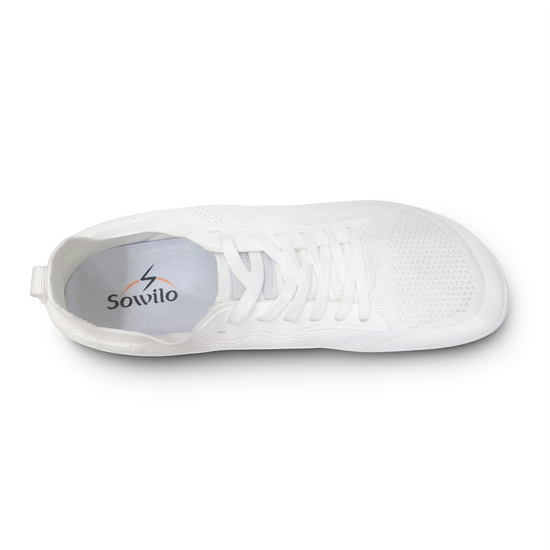 Empeine tejido transpirable zapatilla blanca puntera ancha.
