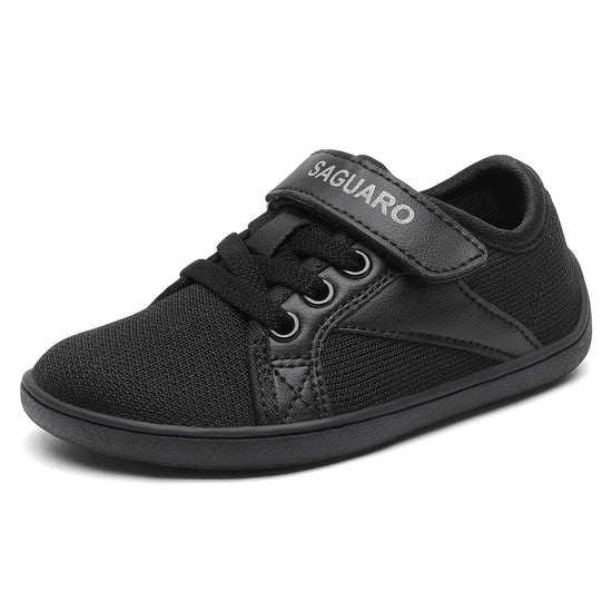 Zapatilla barefoot Saguaro Luck I negra, ideal para colegio, puntera ancha.