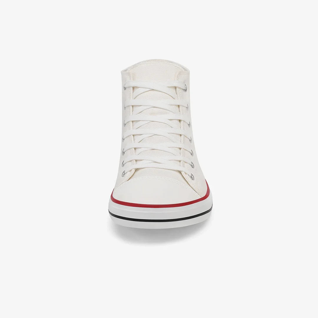 Zapatillas anchas de lona blanca con horma anatómica que permite expandir los dedos.